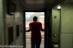 Train-Mumbai-Goa-man-open-door
